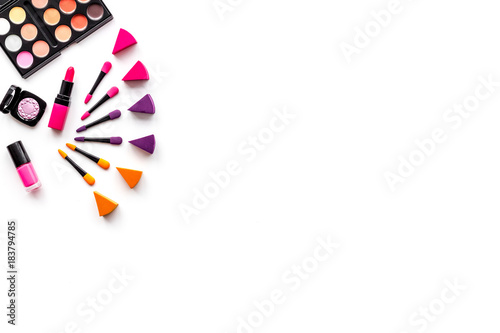 Professional bulk cosmetics. Eyeshadows and applicators on white background top view copyspace