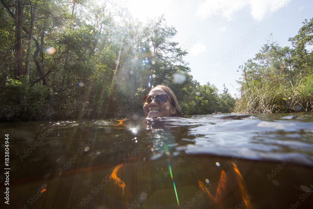Woman swimming in water, Destin, Florida Woman swimming in water, Destin, Florida