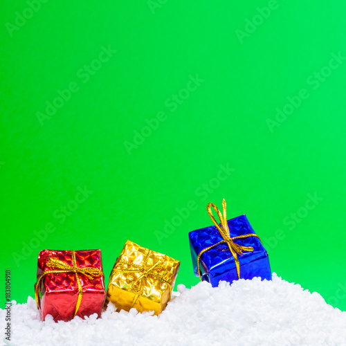 CHRISTMAS GIFT BOXES ON GREEN © EyeMFlatBoard