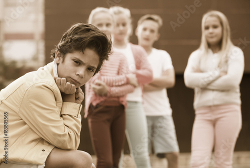 Boy 8-11 years old is outlaw from his friends