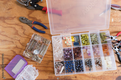 Jewellery makers tools on workbench, overhead view