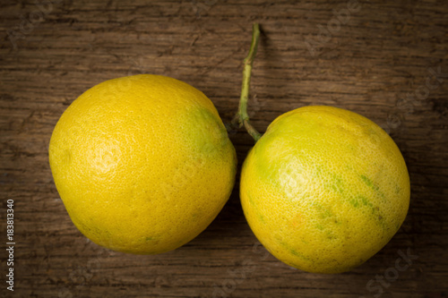 Bergamot oranges color yellow on old wood