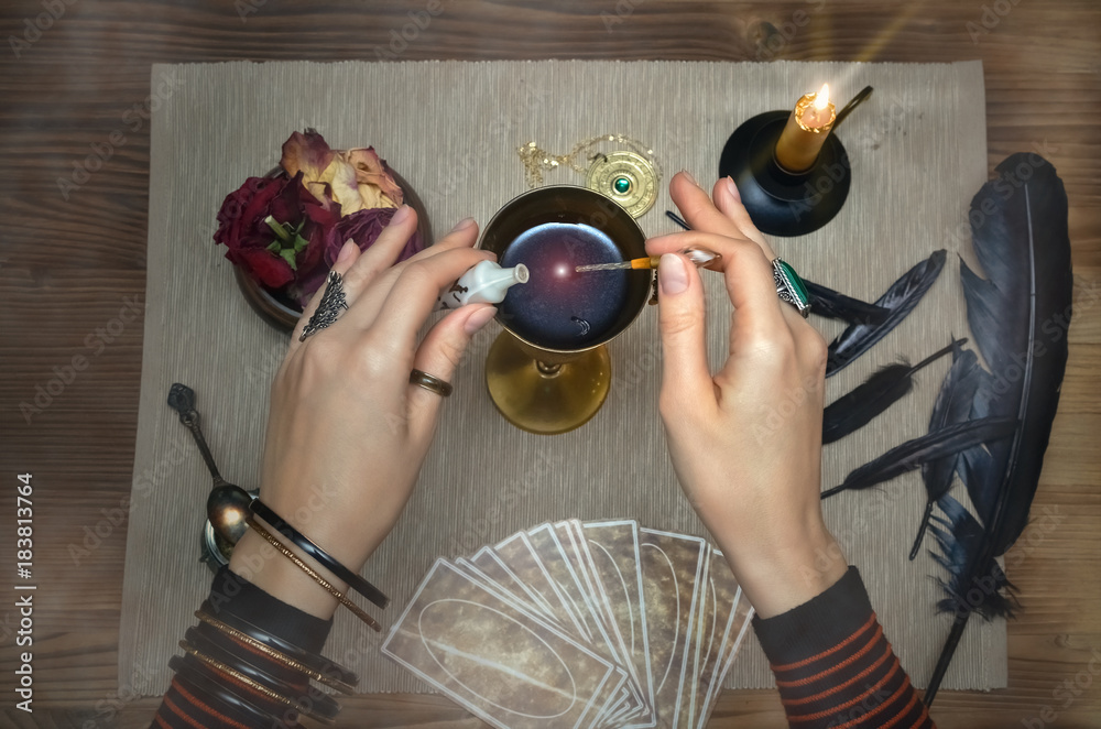 Magic potion. Tarot cards on fortune teller desk table. Future reading.