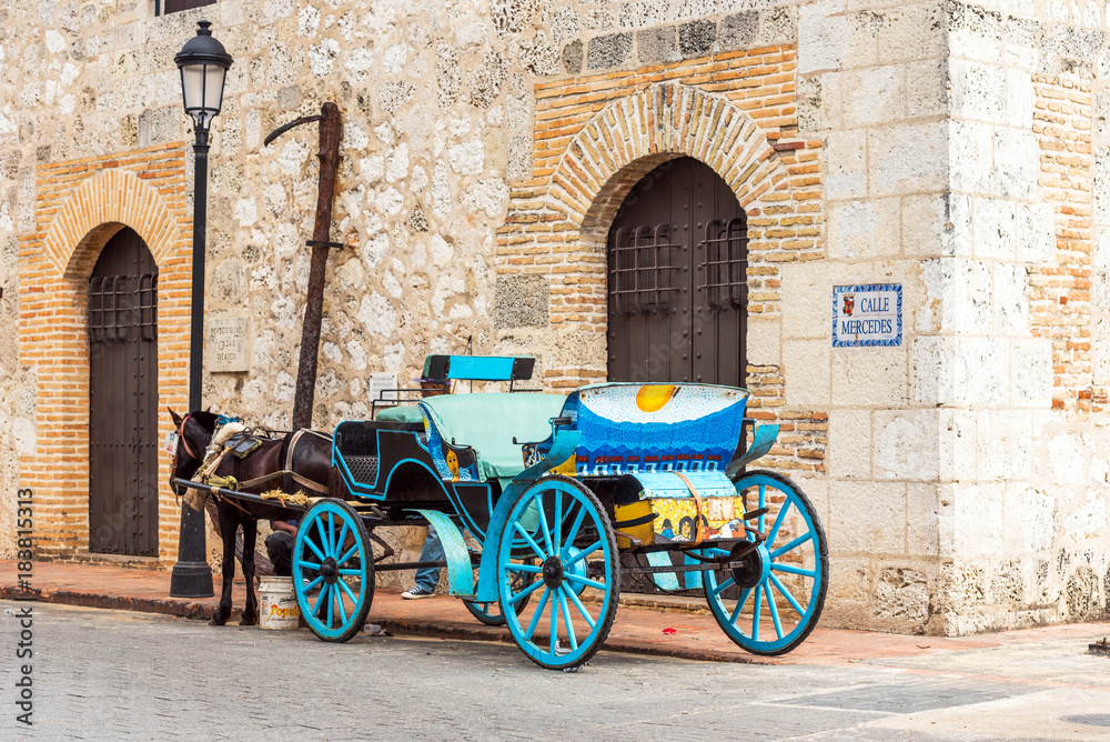Retro carriage with a horse on a city street in Santo Domingo, Dominican Republic. Copy space for text.