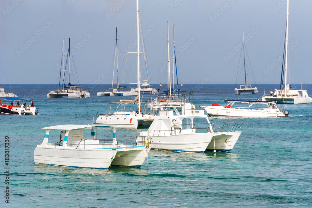 The boats near the shore in Bayahibe, La Altagracia, Dominican Republic. Copy space for text. The boats near the shore in Bayahibe, La Altagracia, Dominican Republic. Copy space for text.
