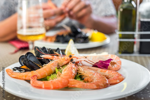 Tasty seafood on plate on table close-up, Siurana, Catalunya, Spain.