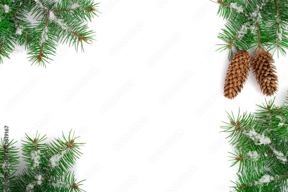 Frame of Fir tree branch with snow and cone isolated on white background with copy space for your text. Top view Frame of Fir tree branch with snow and cone isolated on white background with copy space for your text. Top view