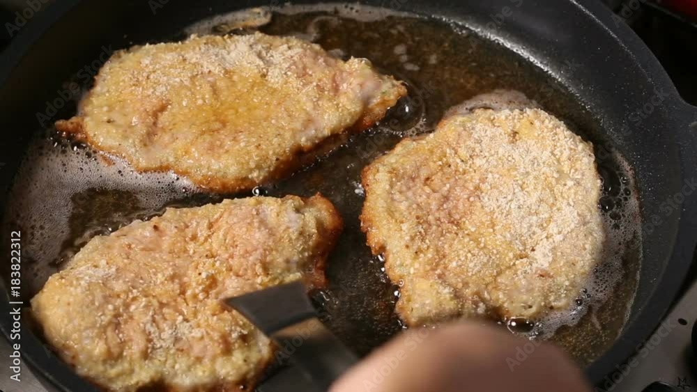 Frying pork meat coated with breadcrumbs in a pan
Frying pork meat coated with breadcrumbs in a pan