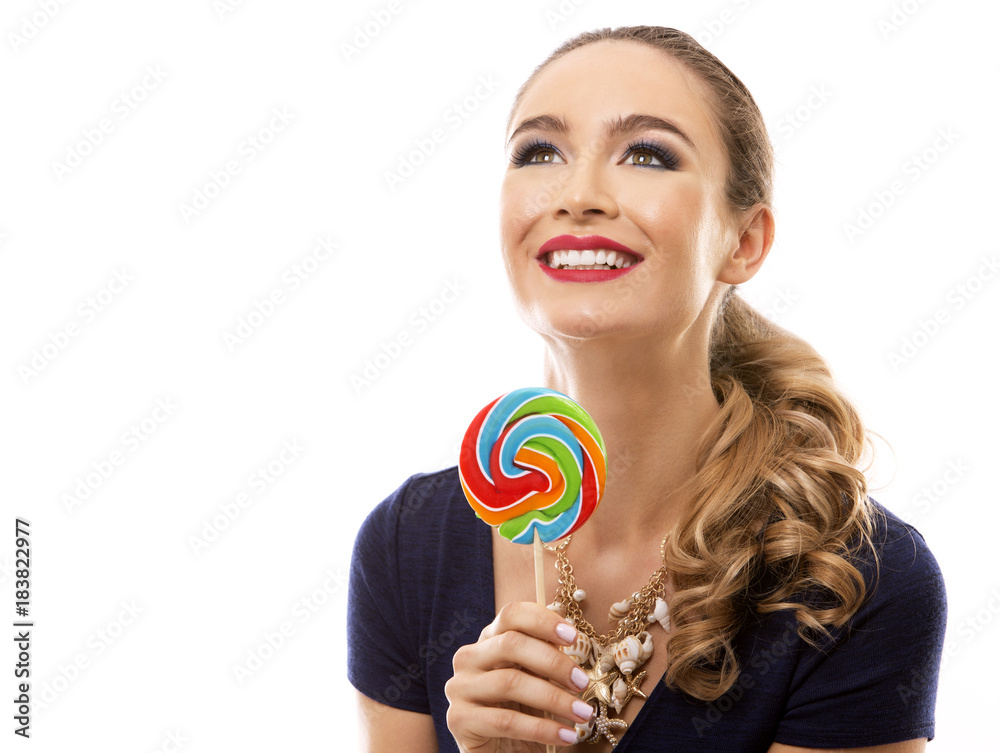 caucasian woman wearing swimsuit, hat and holding lollypop