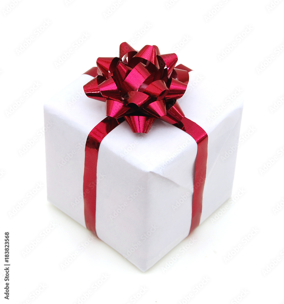 Gift box with ribbon and bow isolated on the white background Gift box with ribbon and bow isolated on the white background