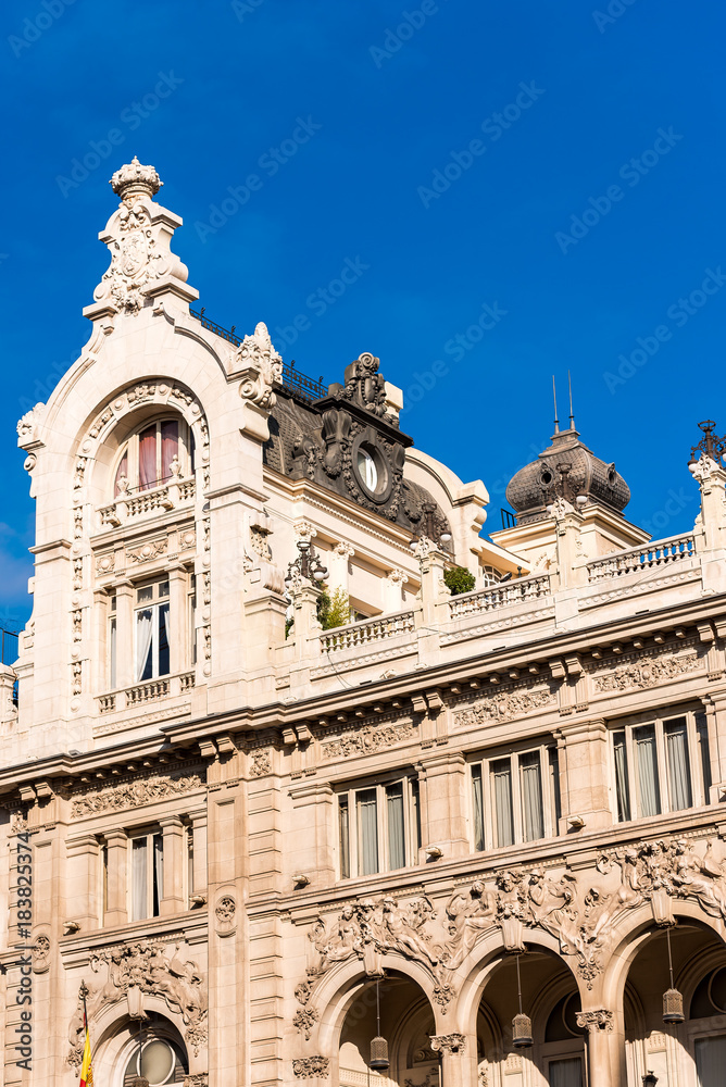 Beautiful historical building of old architecture in the city center, Madrid, Spain. Copy space for text. Vertical.