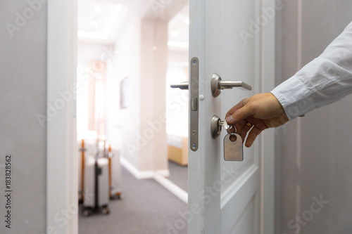 Opening a hotel door concept photo