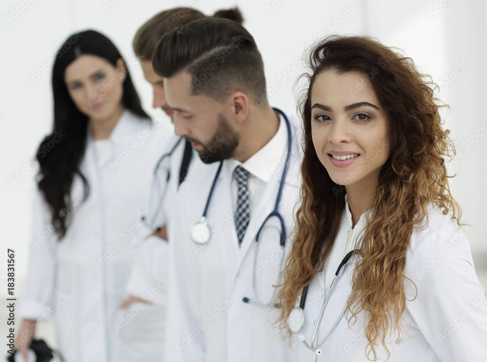 portrait of female doctors with colleagues portrait of female doctors with colleagues