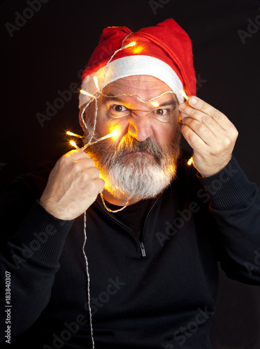Mature man with santa hat photo