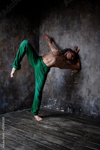 Fototapeta Naklejka Na Ścianę i Meble -  Dancing man, Yoga, Capoeira, Dance, beauty movement