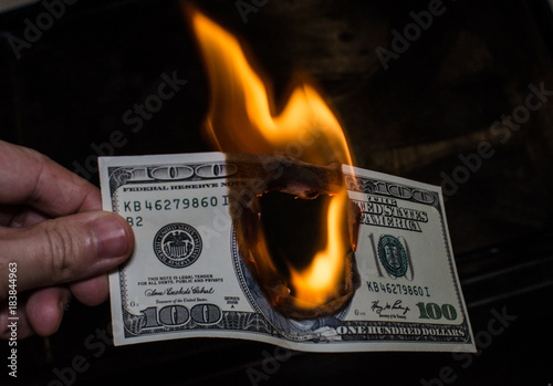 Burning one hundred dollar