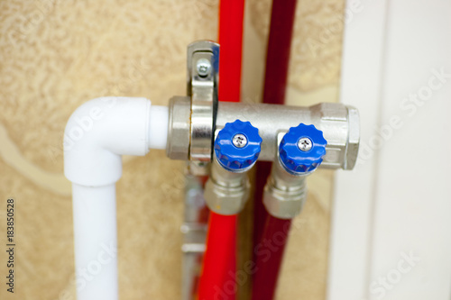 Plumbing from PVC pipes with a hot water collector for connection of a warm floor