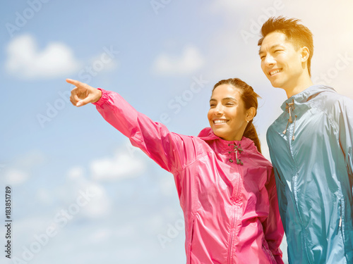Young couple standing at beach