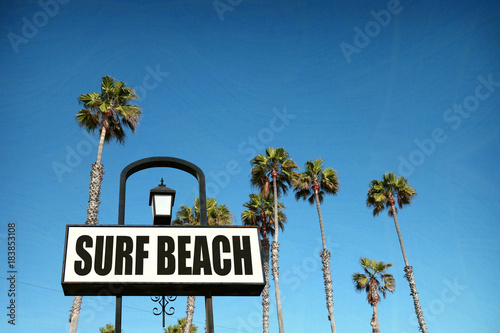 aged and worn surf beach sign