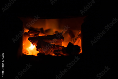 Fire and coals in brick fireplace furnace