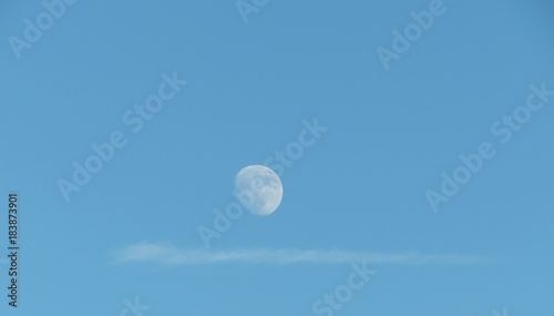 Moon against blue sky, natural background 