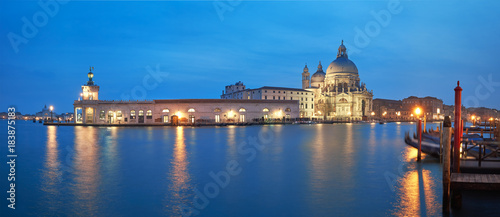 Illuminated Punta della Dogana and church Santa Maria della Salute in Venice