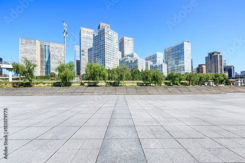 Empty city square road and modern business district office buildings in Beijing,China