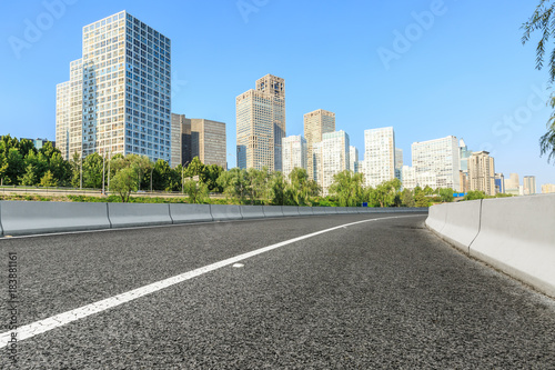 Asphalt road and modern city commercial buildings in Beijing,China