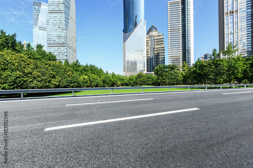 Asphalt road and modern city commercial buildings in Shanghai,China