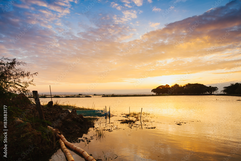 Landscape view of Nong Han lake with sunset and twilight scene in Sakon