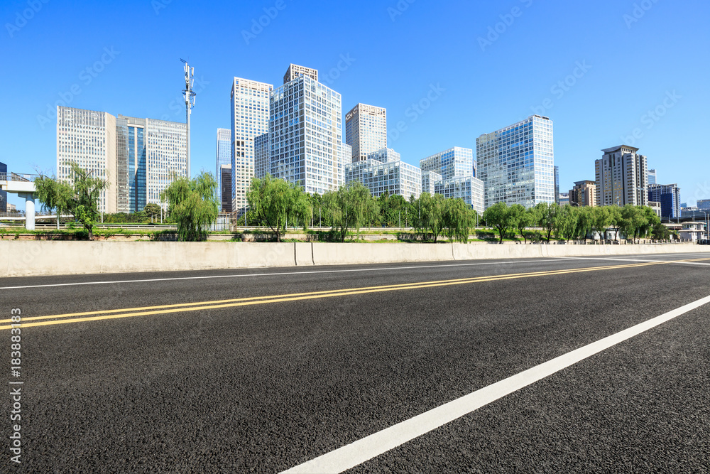 Asphalt road and modern city commercial buildings in Beijing,China Asphalt road and modern city commercial buildings in Beijing,China
