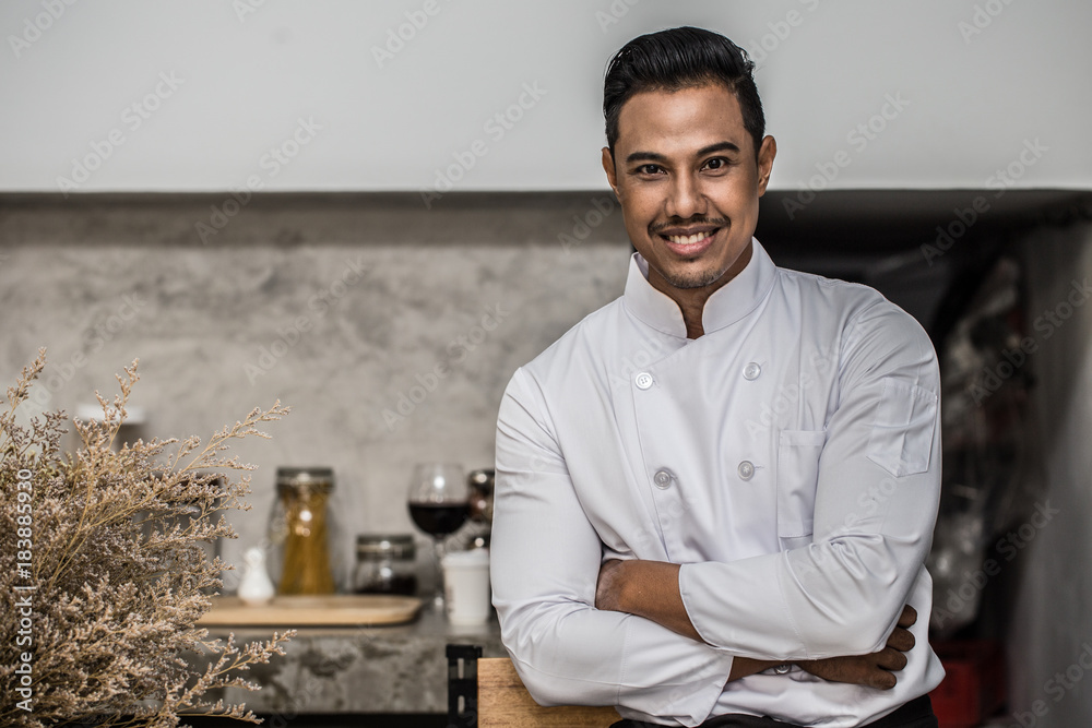 Asian Handsome Chef men cross arm and smile with black skin Asian Handsome Chef men cross arm and smile with black skin