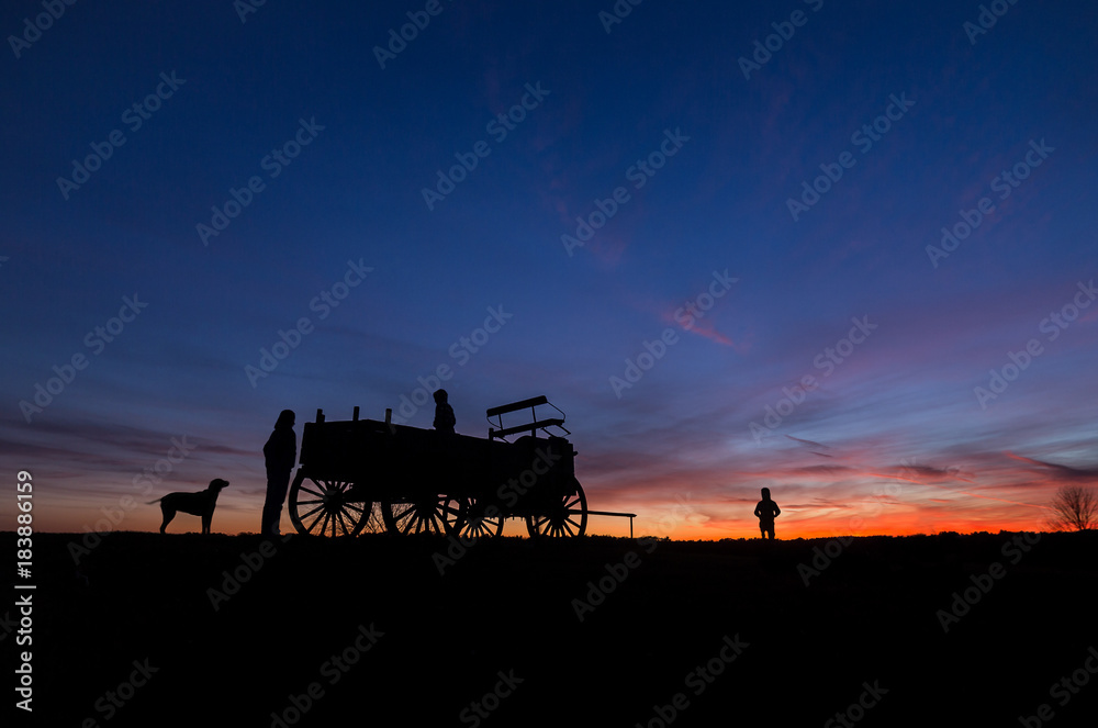 Fototapeta premium Family enjoys a walk at sunset on Wagon Hill Farm in Durham, NH