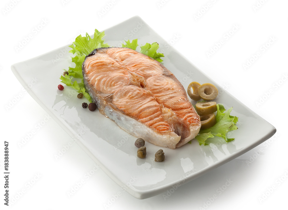 Baked steak of salmon with vegetables, lettuce and pepper Baked steak of salmon with vegetables, lettuce and pepper