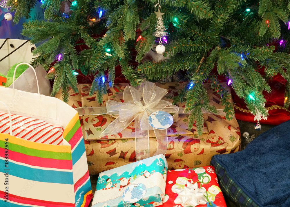 Close up on gift bags and boxes under Christmas tree