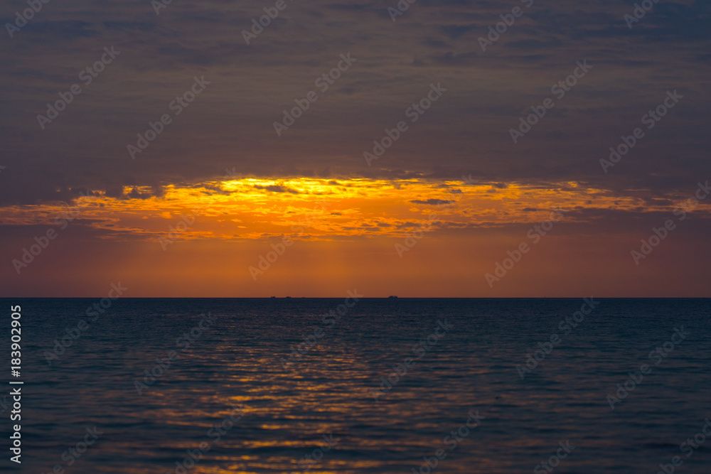 Sunset on the beach orange sky so beautiful nature