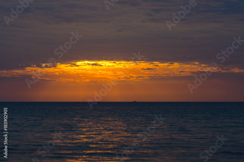 Sunset on the beach orange sky so beautiful nature