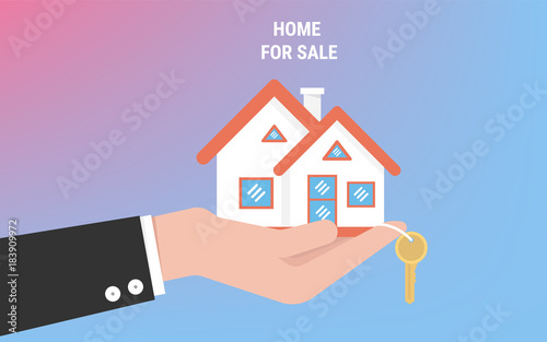 Hand agent with home in palm and key on finger. Offer of purchase house