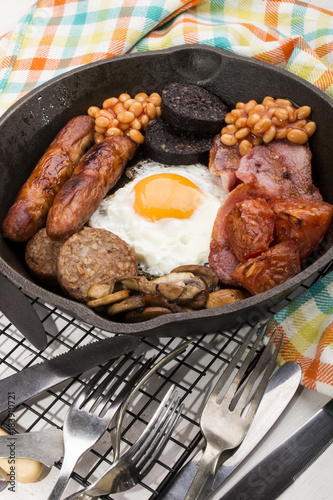 full british breakfast, prepared in a cast iron pan