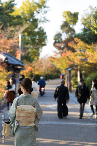 Girl wearing Japanese kimono walking on the  road in japan