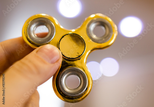 The golden spinner is spinning in his hand