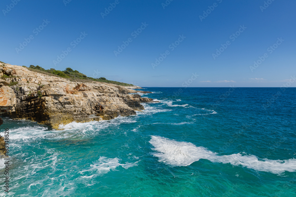 Rocky shore of the Adriatic sea after storm