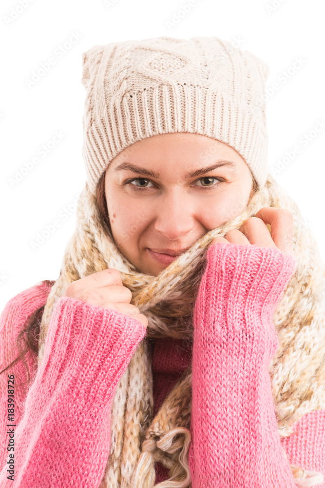 Young female model wearing warm knitted scarf and hat Young female model wearing warm knitted scarf and hat