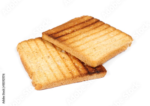 Integral fried whole wheat toast bread slices isolated on white background