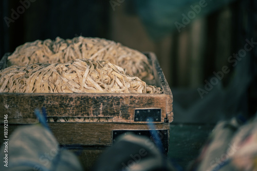 Photography Handmade noodles in the wooden box on the local market in Chinatown, Kuala lumpur