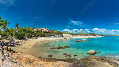 Fototapeta Naklejka Na Ścianę i Meble -  BOWEN, AUS - SEP 18 2017: Horseshoe Bay at Bowen - iconic beach with palm trees, Queensland, Australia