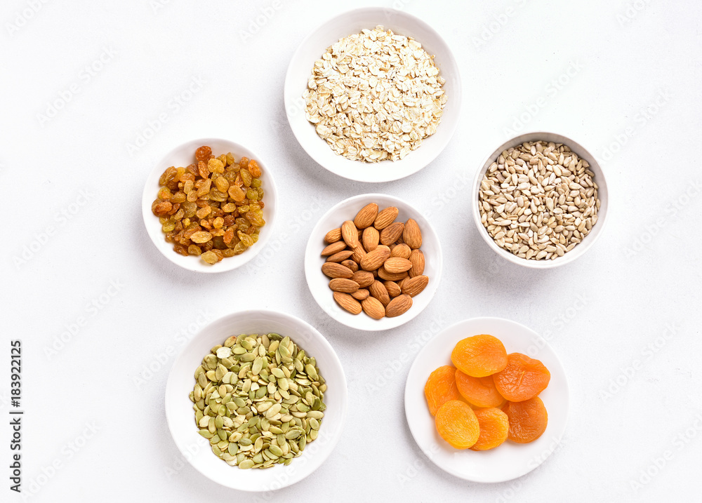 Bowl with ingredients for cooking granola Bowl with ingredients for cooking granola