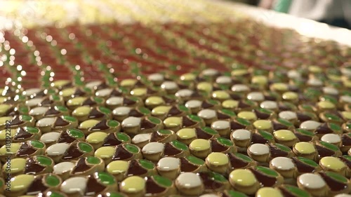 Cake with jam. A large number of cookies with jam lie on a large table photo