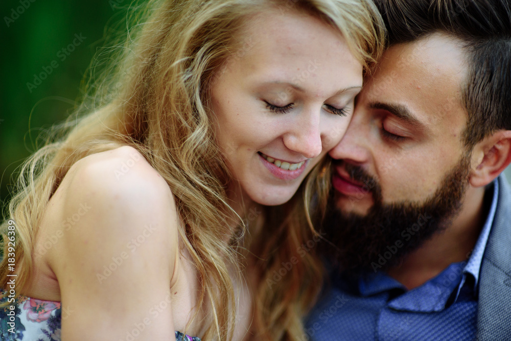 A picture of a young romantic couple with flowers in the village. Tender. A picture of a young romantic couple with flowers in the village. Tender.
