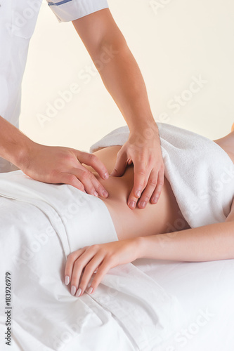 The picture of beautiful woman in massage salon